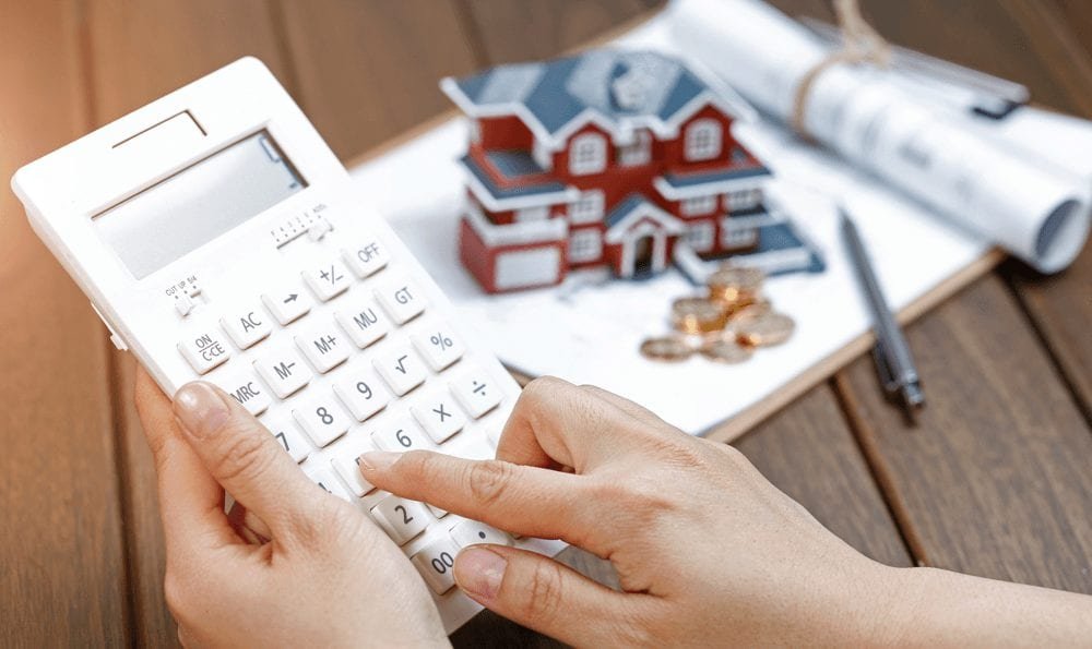 How to Buy a Home and Save a Ton of Money Calculating Image